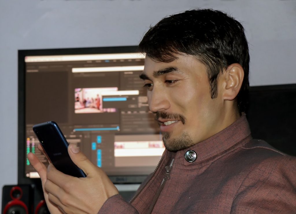 Person browsing IPTV channels on a tablet